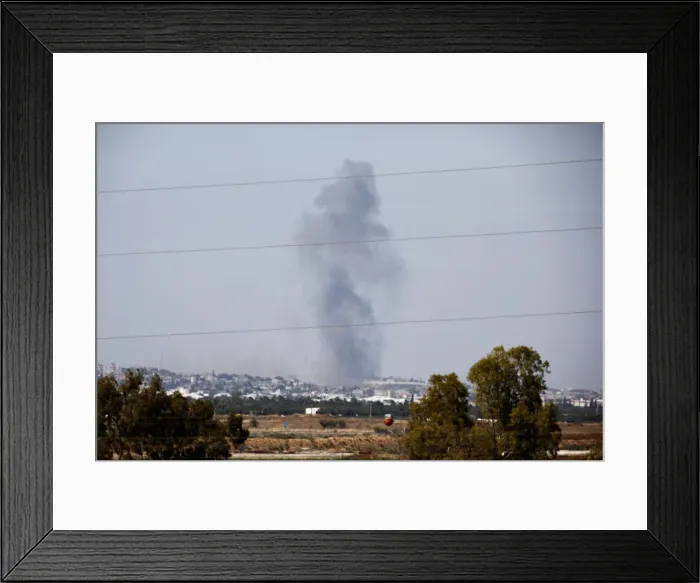 Framed Print : Smoke rises following an explosion in the northern Gaza Strip Framed Print : Smoke rises following an explosion in the northern Gaza Strip
