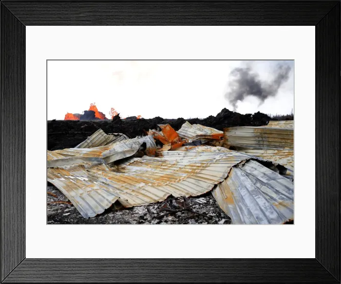 Framed Print : A destroyed structure is seen as lava pours out of a fissure Framed Print : A destroyed structure is seen as lava pours out of a fissure