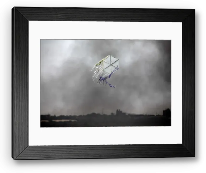 Framed Print : A kite flies over the border in an area where kites and balloons have caused blazes Framed Print : A kite flies over the border in an area where kites and balloons have caused blazes