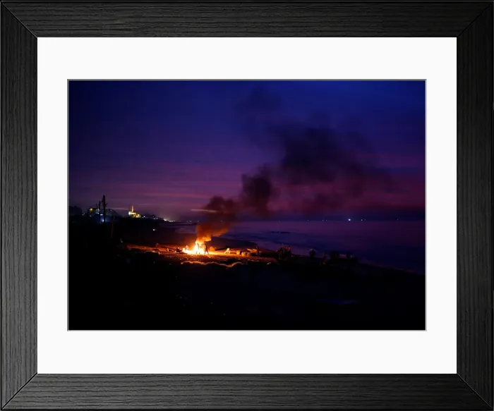 Framed Print : Palestinian fishermen warm themselves by a fire at a beach on a winter day Framed Print : Palestinian fishermen warm themselves by a fire at a beach on a winter day