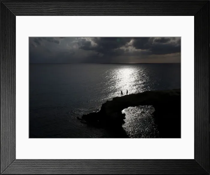 Framed Print : People walk on a natural rock arch in Ayia Napa Framed Print : People walk on a natural rock arch in Ayia Napa