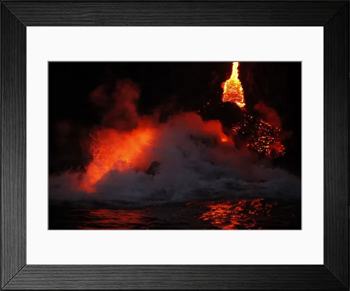 Framed Print : Waves crash over lava as it flows into the ocean near Volcanoes National Park in Kalapana