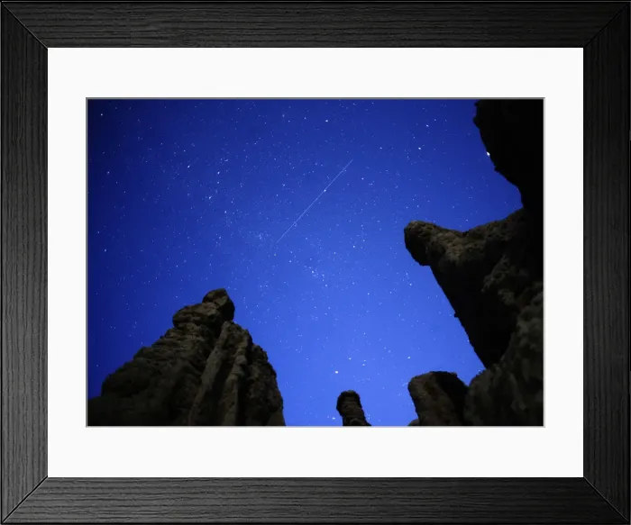 Framed Print : A meteor streaks past stars in the night sky over the village of Kuklici Framed Print : A meteor streaks past stars in the night sky over the village of Kuklici