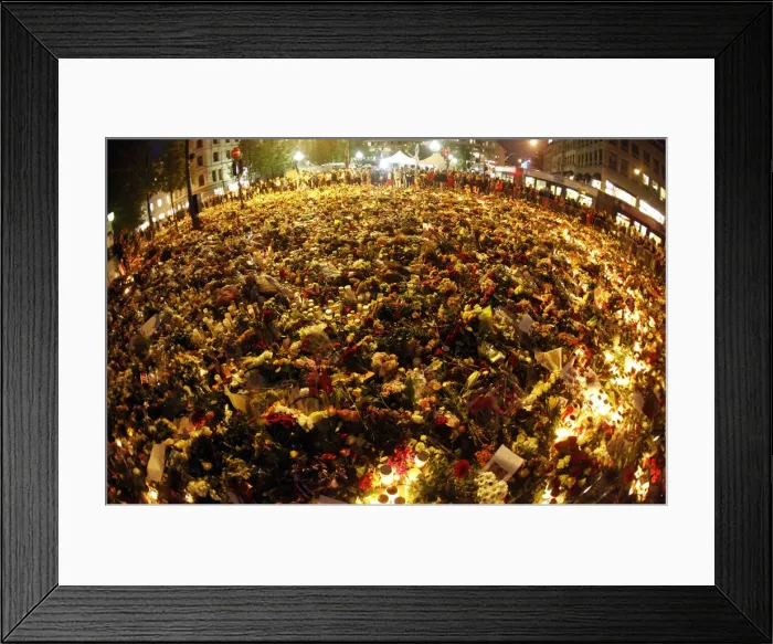 Framed Print : A sea of flowers and lit candles are placed in memory of those killed in Fridays bomb Framed Print : A sea of flowers and lit candles are placed in memory of those killed in Fridays bomb