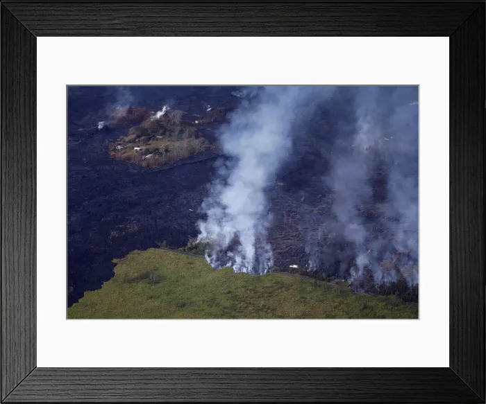 Framed Print : Lava crosses over Pohoiki Road in the Malama Ki area near Kapoho, Hawaii Framed Print : Lava crosses over Pohoiki Road in the Malama Ki area near Kapoho, Hawaii