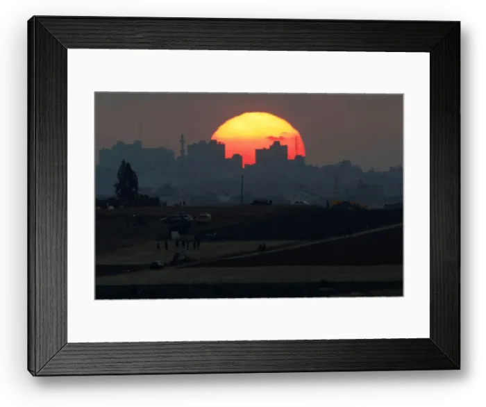 Framed Print : The sun sets over the Gaza Strip, as seen from the Israeli side of the border Framed Print : The sun sets over the Gaza Strip, as seen from the Israeli side of the border