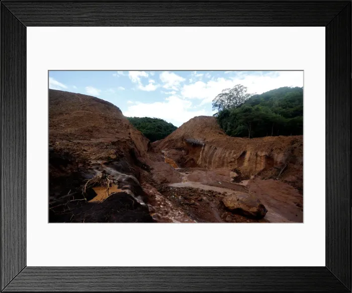 Framed Print : A general view shows the dam that burst its walls, overrunning nearby homes Framed Print : A general view shows the dam that burst its walls, overrunning nearby homes