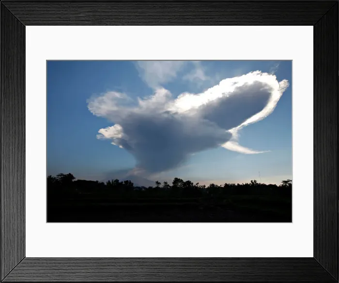 Framed Print : A view of Mount Merapi following a phreatic eruption as seen from Donoharjo village Framed Print : A view of Mount Merapi following a phreatic eruption as seen from Donoharjo village