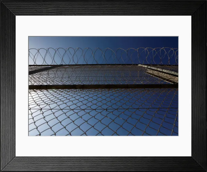 Framed Print : The border fence separating Spains northern enclave Ceuta and Morocco is seen from Ceuta Framed Print : The border fence separating Spains northern enclave Ceuta and Morocco is seen from Ceuta