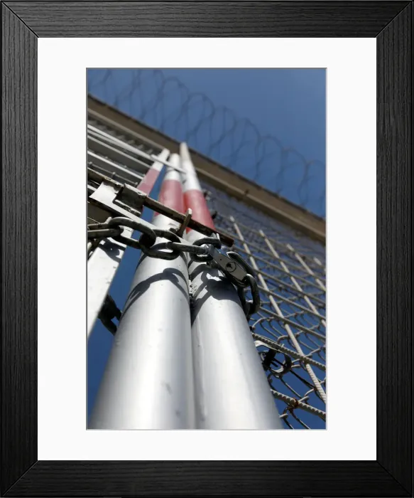 Framed Print : The border fence separating Spains northern enclave Ceuta and Morocco is seen from Ceuta