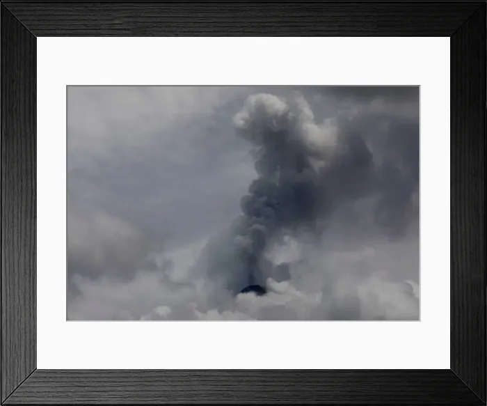 Framed Print : Smoke spews from the Fuego volcano, seen from San Miguel Los Lotes in Escuintla