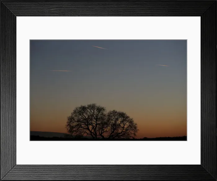 Framed Print : Passenger planes leave behind contrails as they fly in the skies over London Luton Framed Print : Passenger planes leave behind contrails as they fly in the skies over London Luton