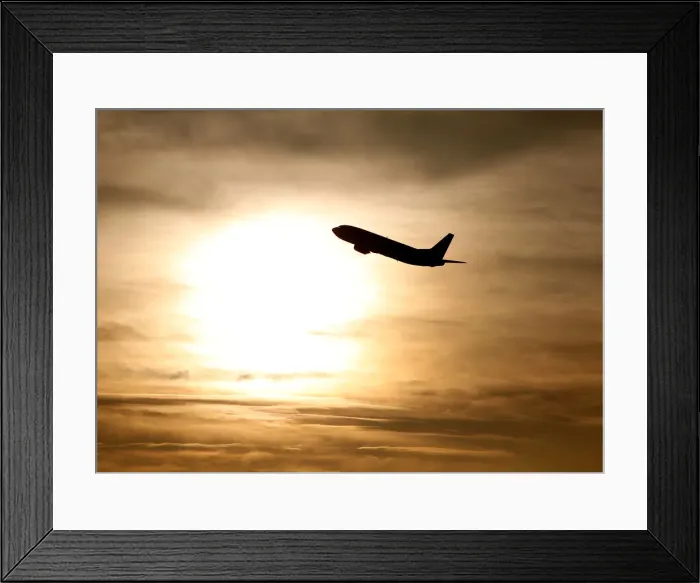 Framed Print : A plane is seen during sunrise at the international airport in Munich Framed Print : A plane is seen during sunrise at the international airport in Munich
