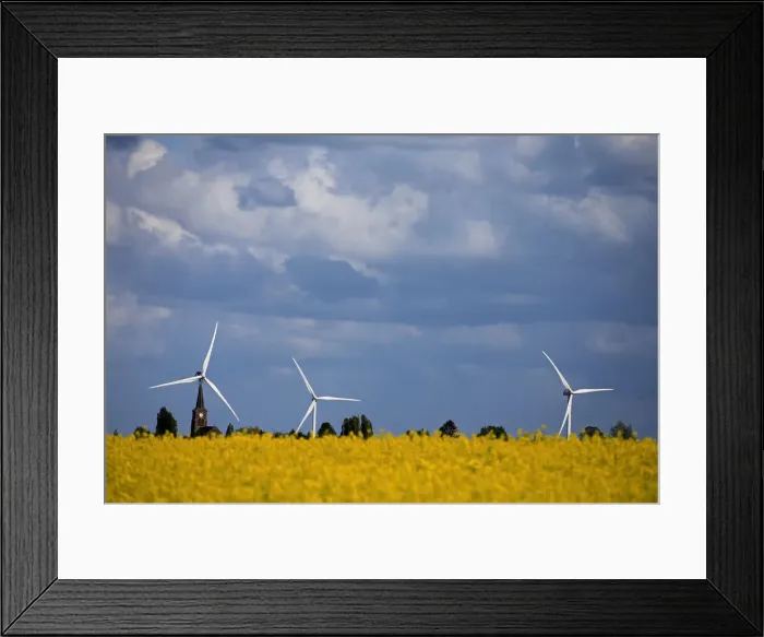 Framed Print : Church and windmills of the village of Saint-Hilaire-Lez-Cambrai are seen behind a Framed Print : Church and windmills of the village of Saint-Hilaire-Lez-Cambrai are seen behind a