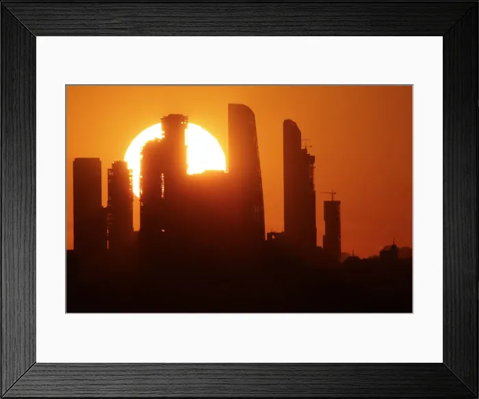 Framed Print : The sun sets behind the skyscrapers of the Moscow International Business Centre in Moscow