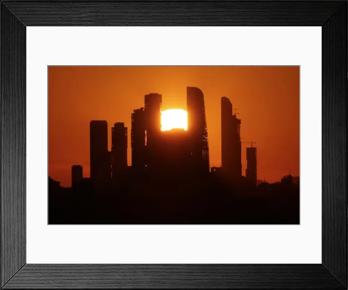 Framed Print : The sun sets behind the skyscrapers of the Moscow International Business Centre in Moscow Framed Print : The sun sets behind the skyscrapers of the Moscow International Business Centre in Moscow