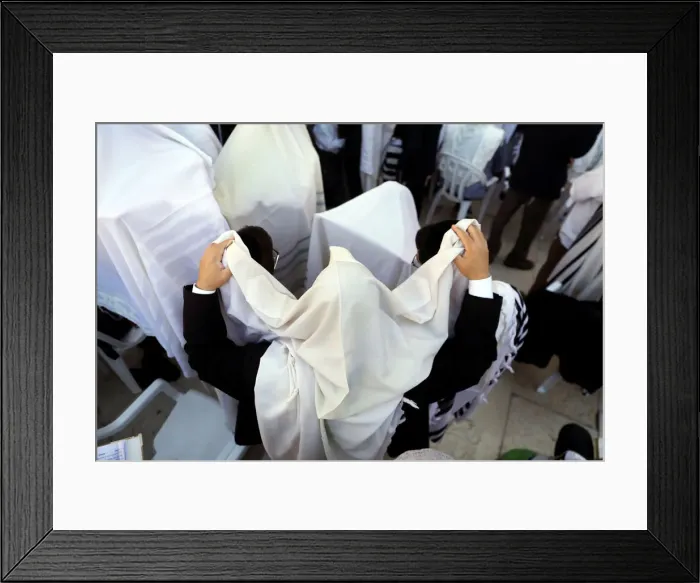 Framed Print : Jewish worshippers wrapped in prayer shawls participate in the priestly blessing prayer