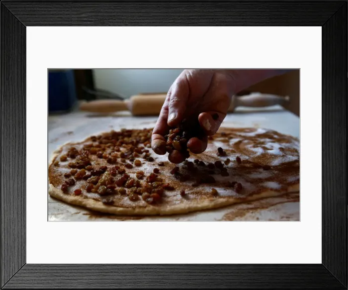 Framed Print : Woman bakes traditional cakes on the eve of Orthodox Easter in the town of Bobruisk