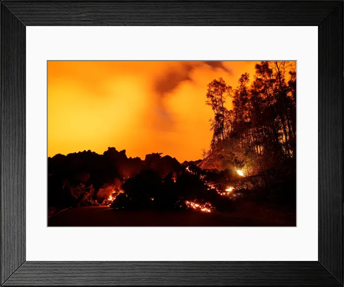 Framed Print : A lava flow from the Kilauea volcano illuminates the night sky Framed Print : A lava flow from the Kilauea volcano illuminates the night sky