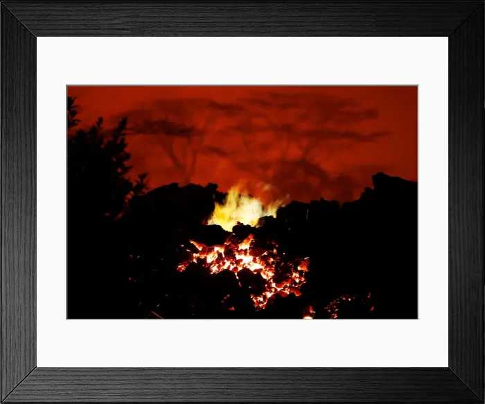 Framed Print : Methane gas burns from the lava flow that crossed Kahukai St