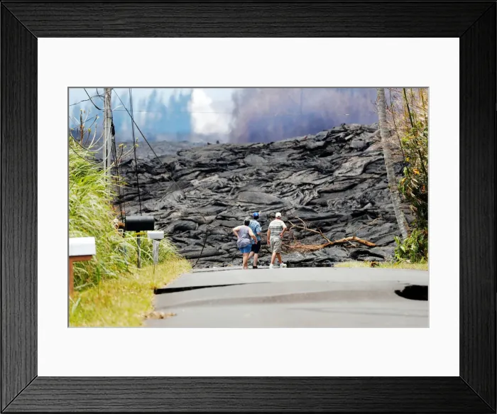 Framed Print : Onlooks stare at the lava field from the eruption of the Kilauea Volcano in the Leilani