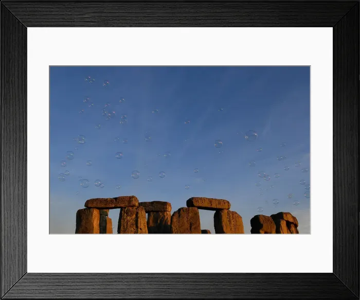 Framed Print : Revellers welcome in the Summer Solstice at Stonehenge stone circle in southwest Britain Framed Print : Revellers welcome in the Summer Solstice at Stonehenge stone circle in southwest Britain