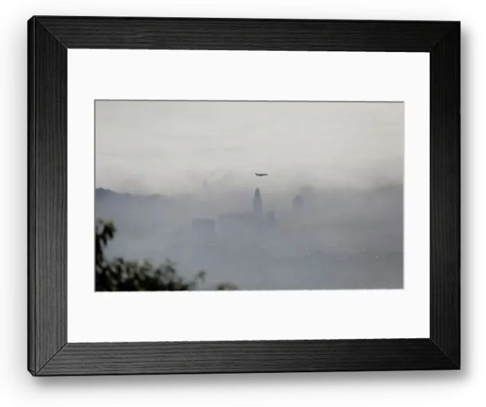 Framed Print : An airplane flies over buildings in Rio de Janeiro Framed Print : An airplane flies over buildings in Rio de Janeiro