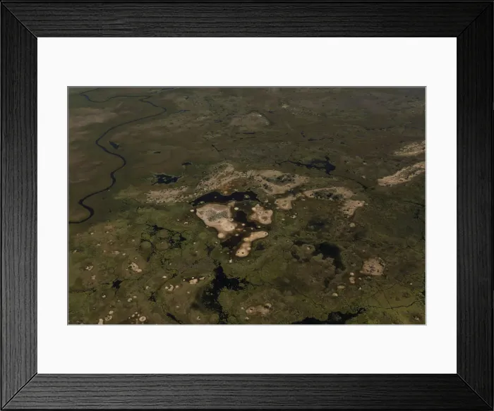 Framed Print : Trees stand on islands as water begins to fill the Okavango Delta