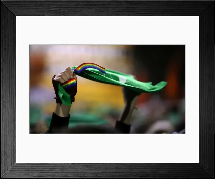 Framed Print : A woman holds up a green handkerchief during a demonstration in favour of legalising Framed Print : A woman holds up a green handkerchief during a demonstration in favour of legalising