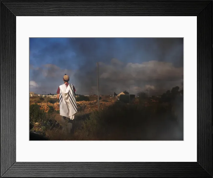 Framed Print : A protestor prays before Israeli security forces come to evacuate 15 Jewish settler Framed Print : A protestor prays before Israeli security forces come to evacuate 15 Jewish settler
