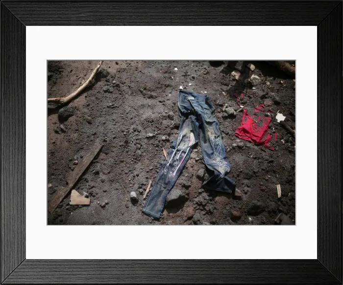 Framed Print : Clothing is seen at an area affected by the eruption of the Fuego volcano at San Miguel Framed Print : Clothing is seen at an area affected by the eruption of the Fuego volcano at San Miguel