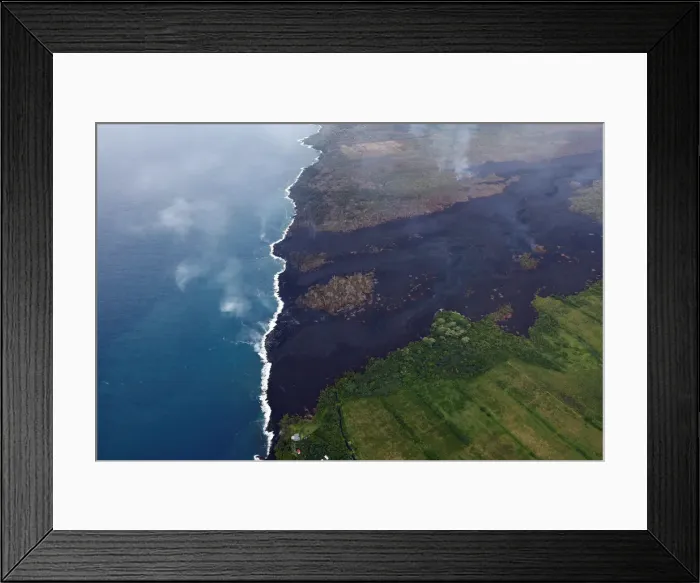 Framed Print : The lava flow cuts across Highway 137 entering the ocean near Kapoho, Hawaii Framed Print : The lava flow cuts across Highway 137 entering the ocean near Kapoho, Hawaii