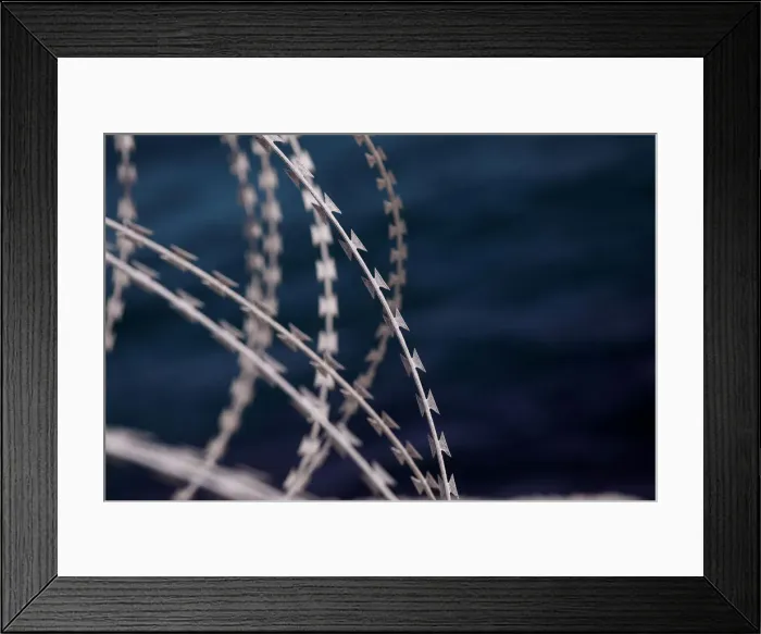 Framed Print : The border fence separating Spains northern enclave Ceuta and Morocco is seen from Ceuta Framed Print : The border fence separating Spains northern enclave Ceuta and Morocco is seen from Ceuta