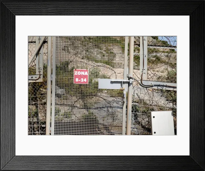 Framed Print : The border fence separating Spains northern enclave Ceuta and Morocco is seen from Ceuta Framed Print : The border fence separating Spains northern enclave Ceuta and Morocco is seen from Ceuta