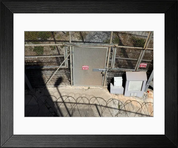 Framed Print : The border fence separating Spains northern enclave Ceuta and Morocco is seen from Ceuta Framed Print : The border fence separating Spains northern enclave Ceuta and Morocco is seen from Ceuta