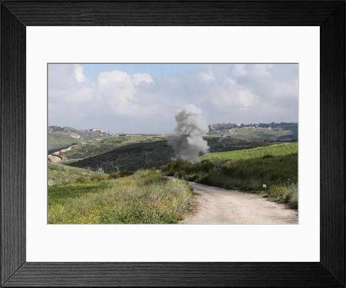 Framed Print : Smoke rises from the Israeli drone after it crashed in Beit Yahoun village Framed Print : Smoke rises from the Israeli drone after it crashed in Beit Yahoun village
