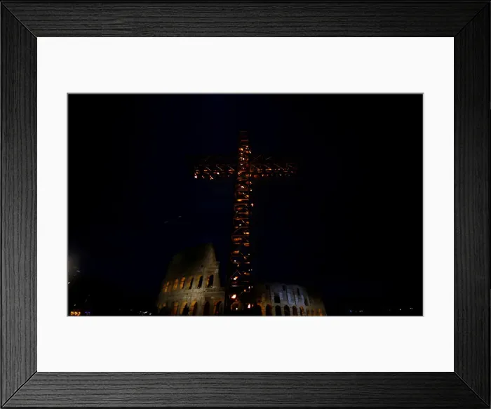 Framed Print : A cross lit up with candles is seen in front of the Colosseum before the Via Crucis