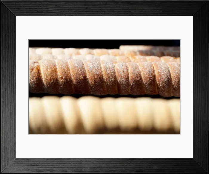 Framed Print : Traditional Trdelnik sweet pastries are prepared at a market in Prague