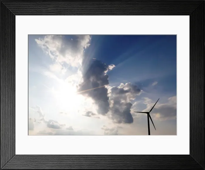 Framed Print : A power-generating wind turbine is seen near the city of Mouchamps Framed Print : A power-generating wind turbine is seen near the city of Mouchamps