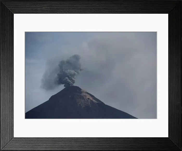 Framed Print : The Fuego volcano spews smoke and ash, as seen from San Miguel Los Lotes in Escuintla Framed Print : The Fuego volcano spews smoke and ash, as seen from San Miguel Los Lotes in Escuintla