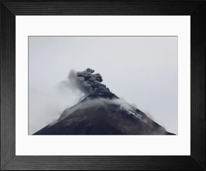 Framed Print : The Fuego volcano spews out a plume of ash and smoke as seen from El Rodeo in Escuintla Framed Print : The Fuego volcano spews out a plume of ash and smoke as seen from El Rodeo in Escuintla
