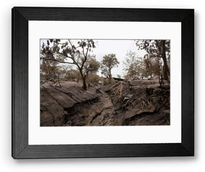 Framed Print : A view of an affected area after the eruption of the Fuego volcano in San Miguel Framed Print : A view of an affected area after the eruption of the Fuego volcano in San Miguel