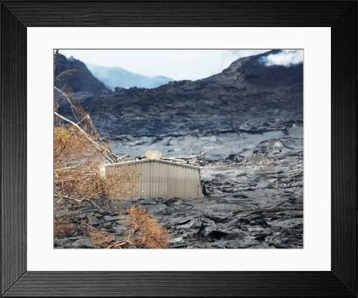 Framed Print : A structure remains swallowed in a lava field from the eruption of the Kilauea Volcano in
