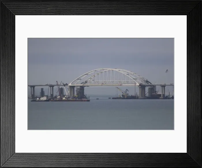 Framed Print : A general view shows a road-and-rail bridge, which is constructed to connect the Russian Framed Print : A general view shows a road-and-rail bridge, which is constructed to connect the Russian
