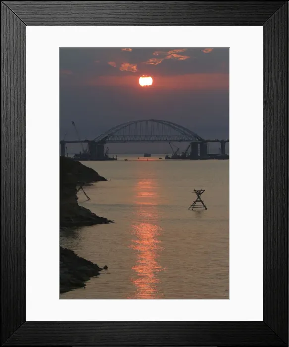 Framed Print : A general view shows a road-and-rail bridge, which is constructed to connect the Russian