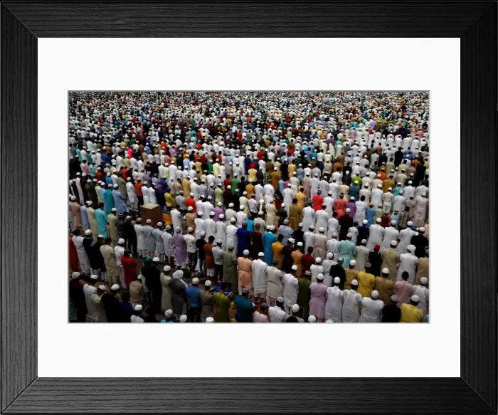 Framed Print : Men offer Eid al-Fitr prayers marking the end of the holy fasting month Ramadan at Jama