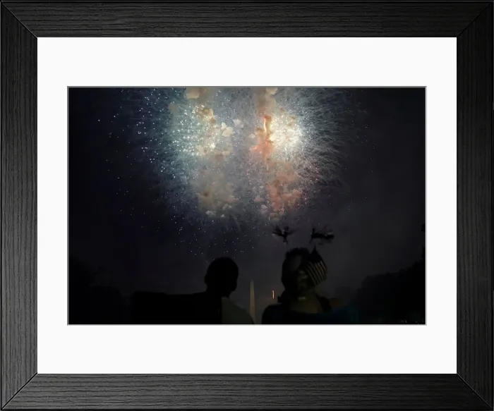Framed Print : People watch fireworks during the 4th of July Independence Day celebrations Framed Print : People watch fireworks during the 4th of July Independence Day celebrations