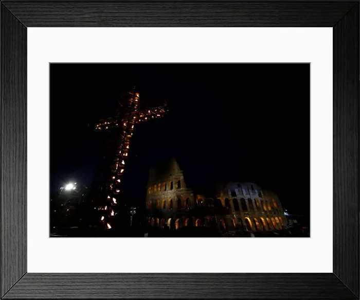 Framed Print : A cross lit up with candles is seen in front of the Colosseum before the Via Crucis Framed Print : A cross lit up with candles is seen in front of the Colosseum before the Via Crucis