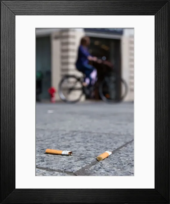Framed Print : Cigarette butts litter the street in Lyon Framed Print : Cigarette butts litter the street in Lyon