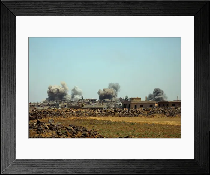 Framed Print : Smoke rises from al-Harak town, as seen from Deraa countryside Framed Print : Smoke rises from al-Harak town, as seen from Deraa countryside